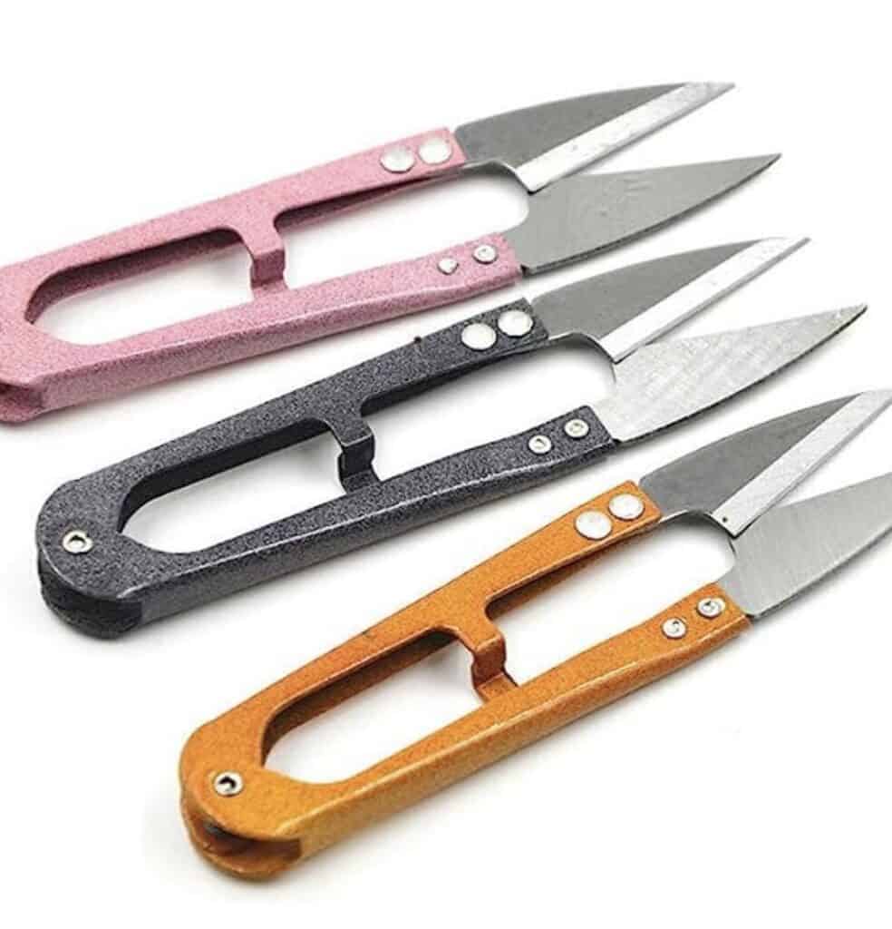 small scissors are an essential tool for a beginner